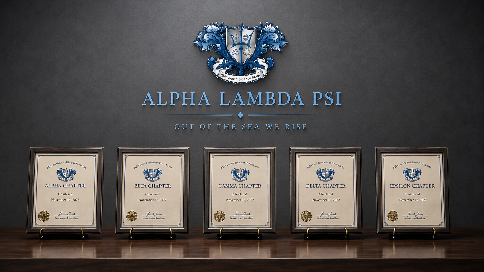 Alpha Lambda Psi Brothers holding the five Chapter charters